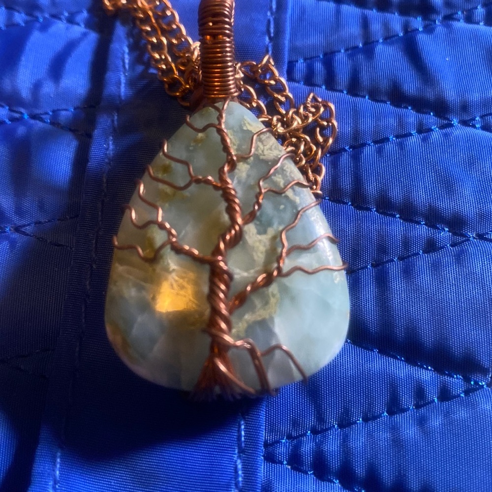 Beautiful turquoise stone, hand wired with matching necklace